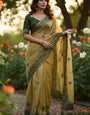 Symmetrical Mustard Organza Silk Saree With Unequalled Full Stitched Blouse