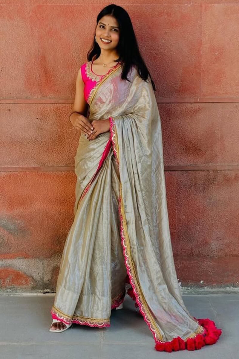 Groovy Beige Tissue Silk Saree With Pulsating Blouse Piece