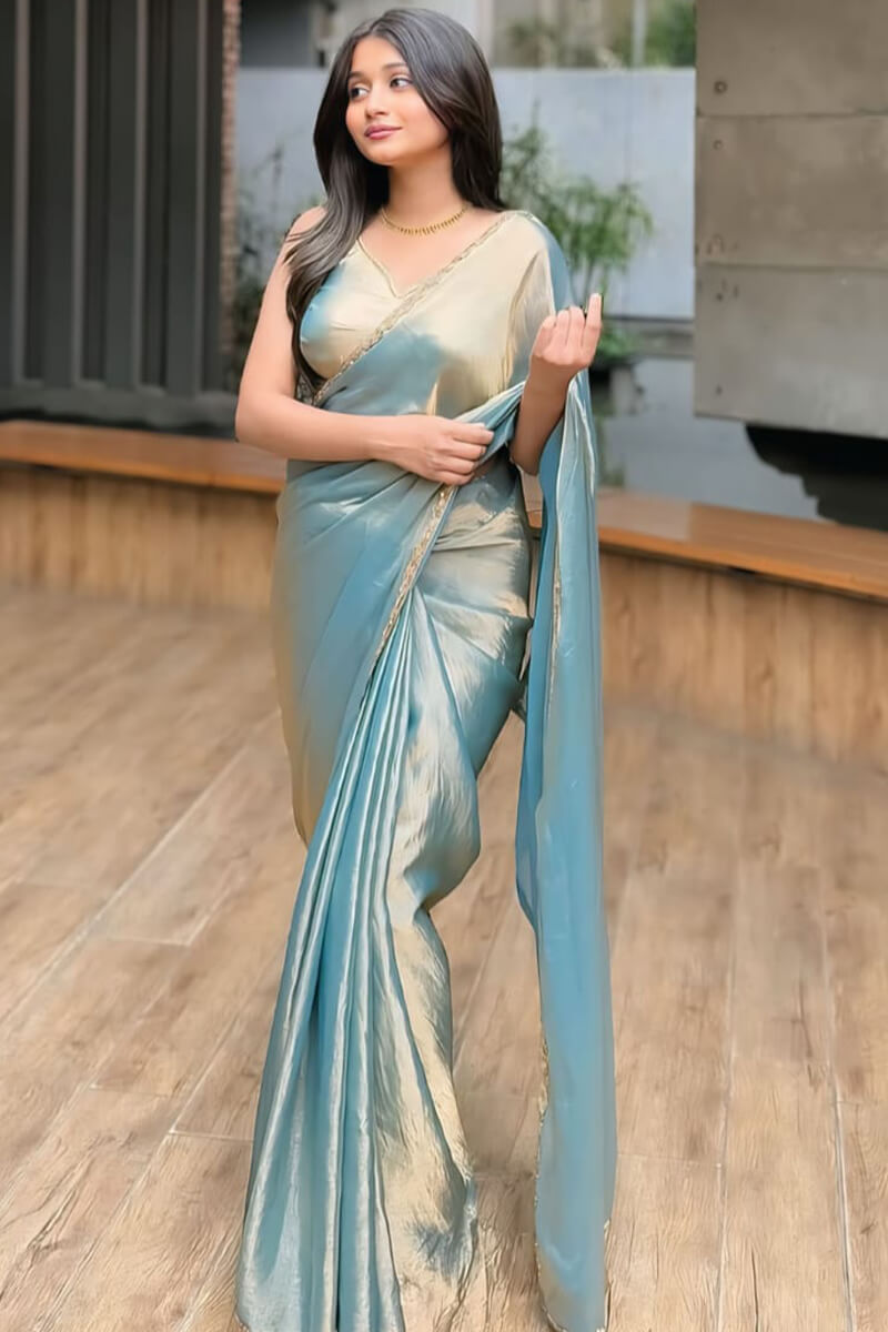 Scintillating Firozi Fancy Silk Saree With Opulent Blouse Piece