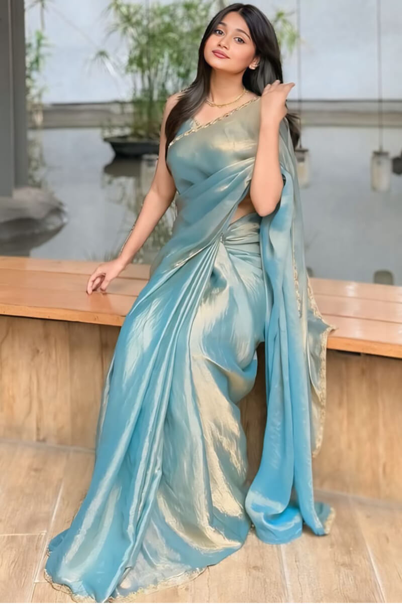 Scintillating Firozi Fancy Silk Saree With Opulent Blouse Piece