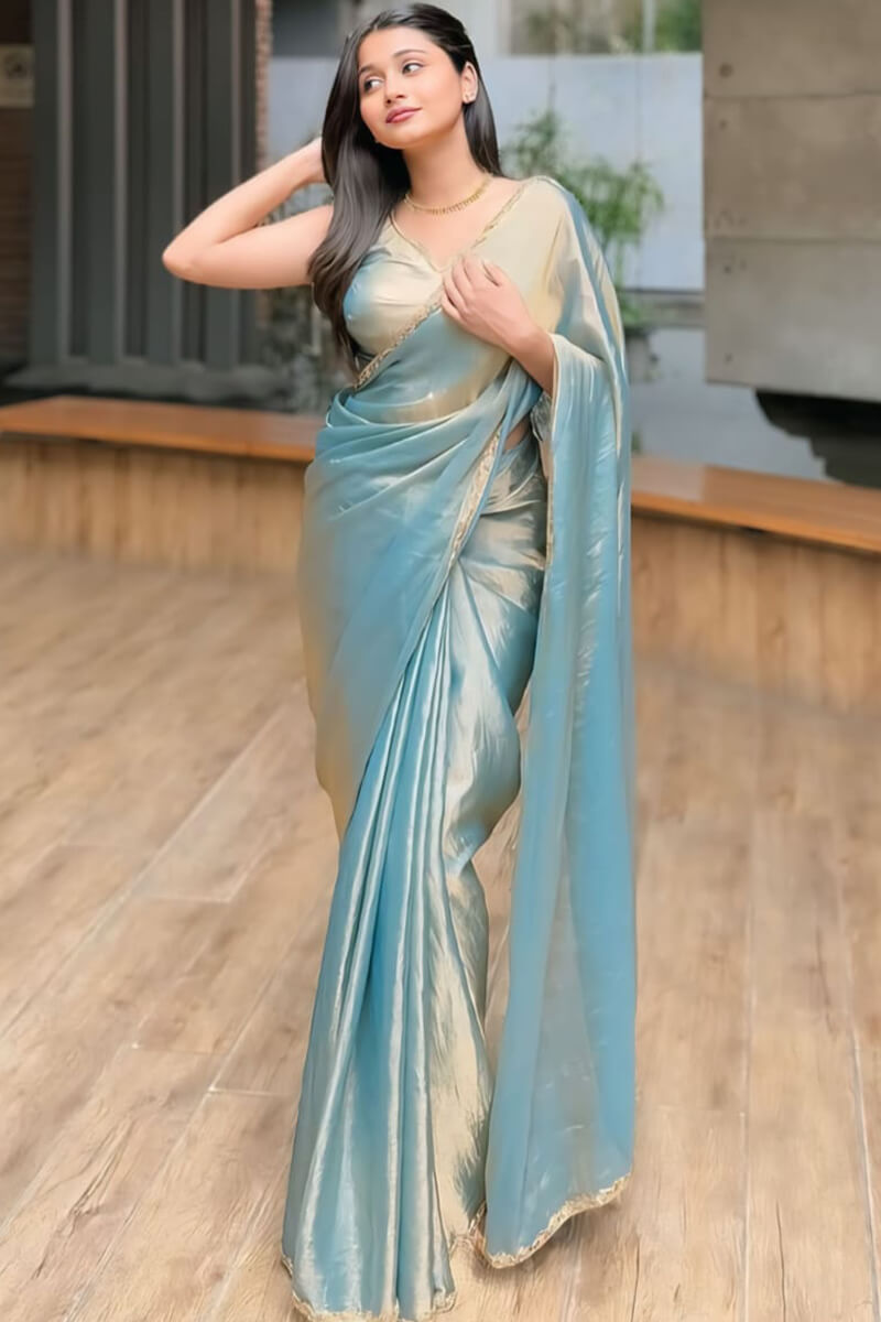 Scintillating Firozi Fancy Silk Saree With Opulent Blouse Piece